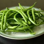 Bean 'Maxi' is an outstanding variety producing high yields of 15cm long, slender, stringless pods